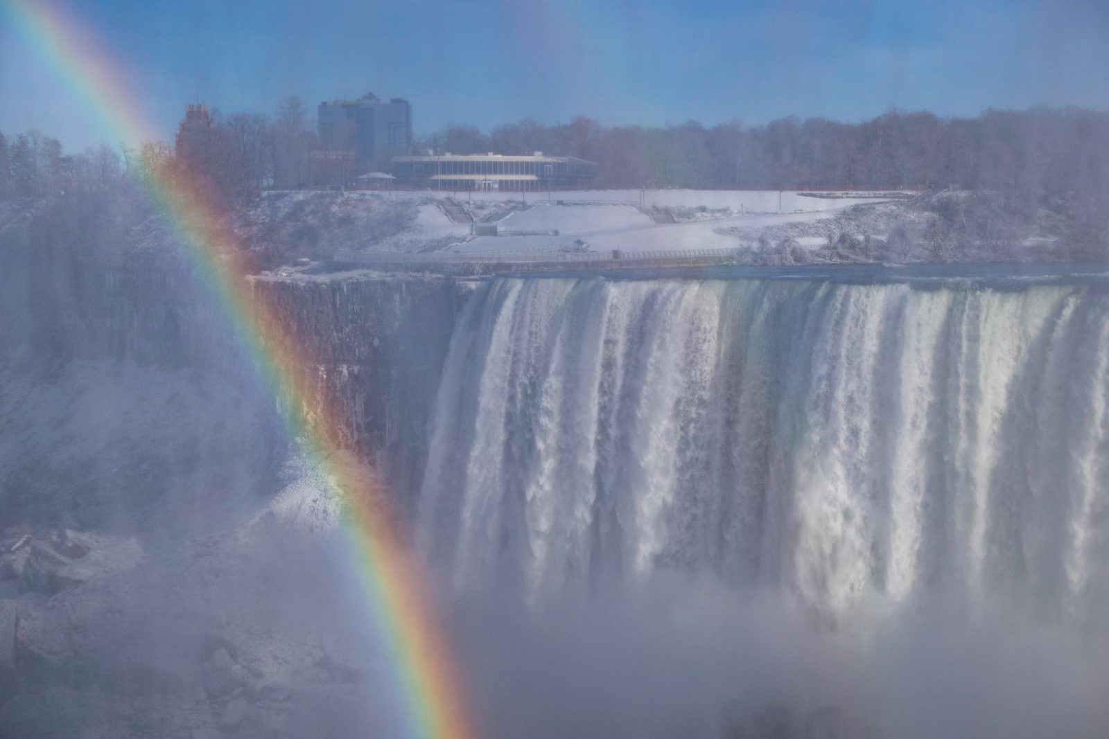 Niagara Falls in winter, with a rainbow