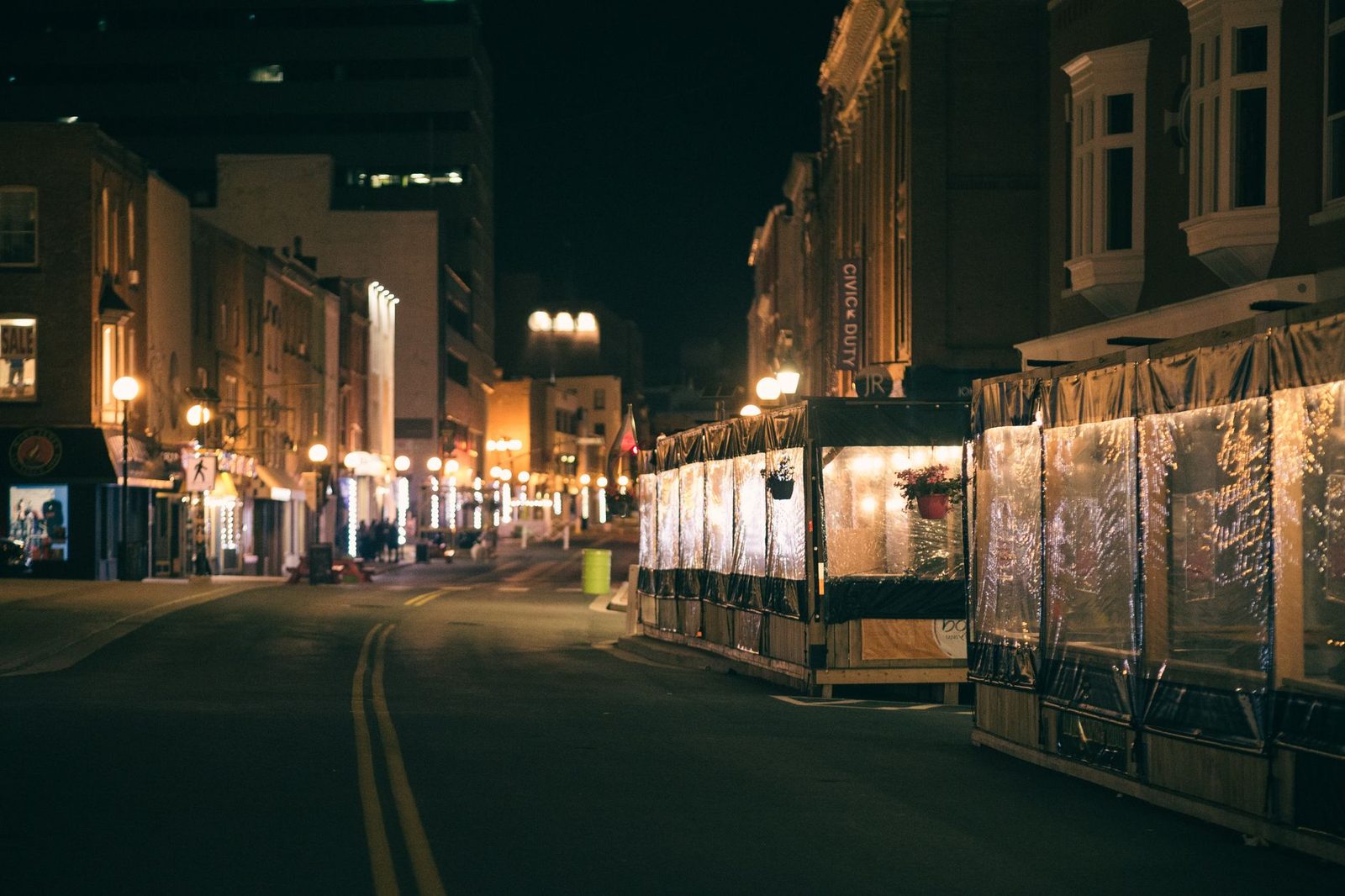 A downtown street after dark