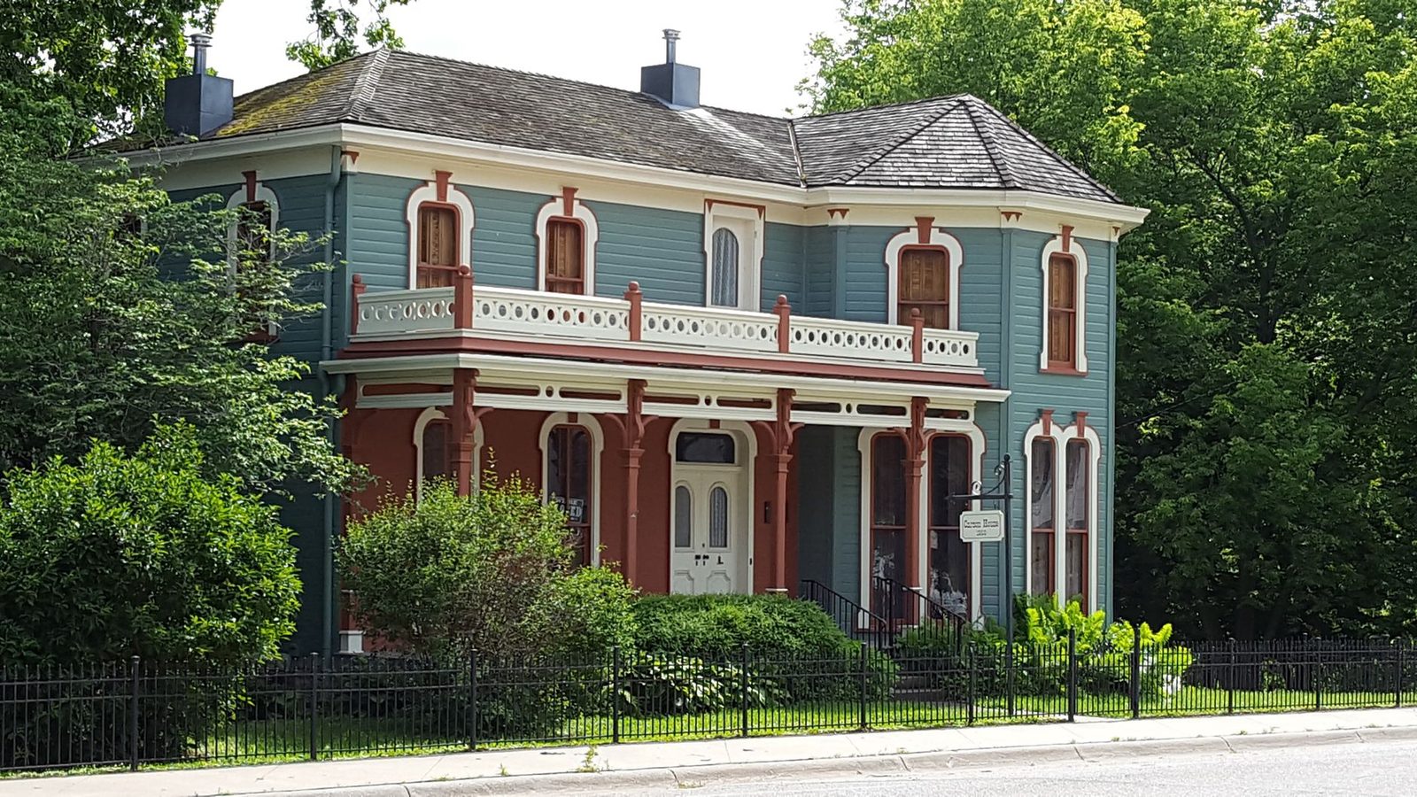 A porch-fronted Victorian house
