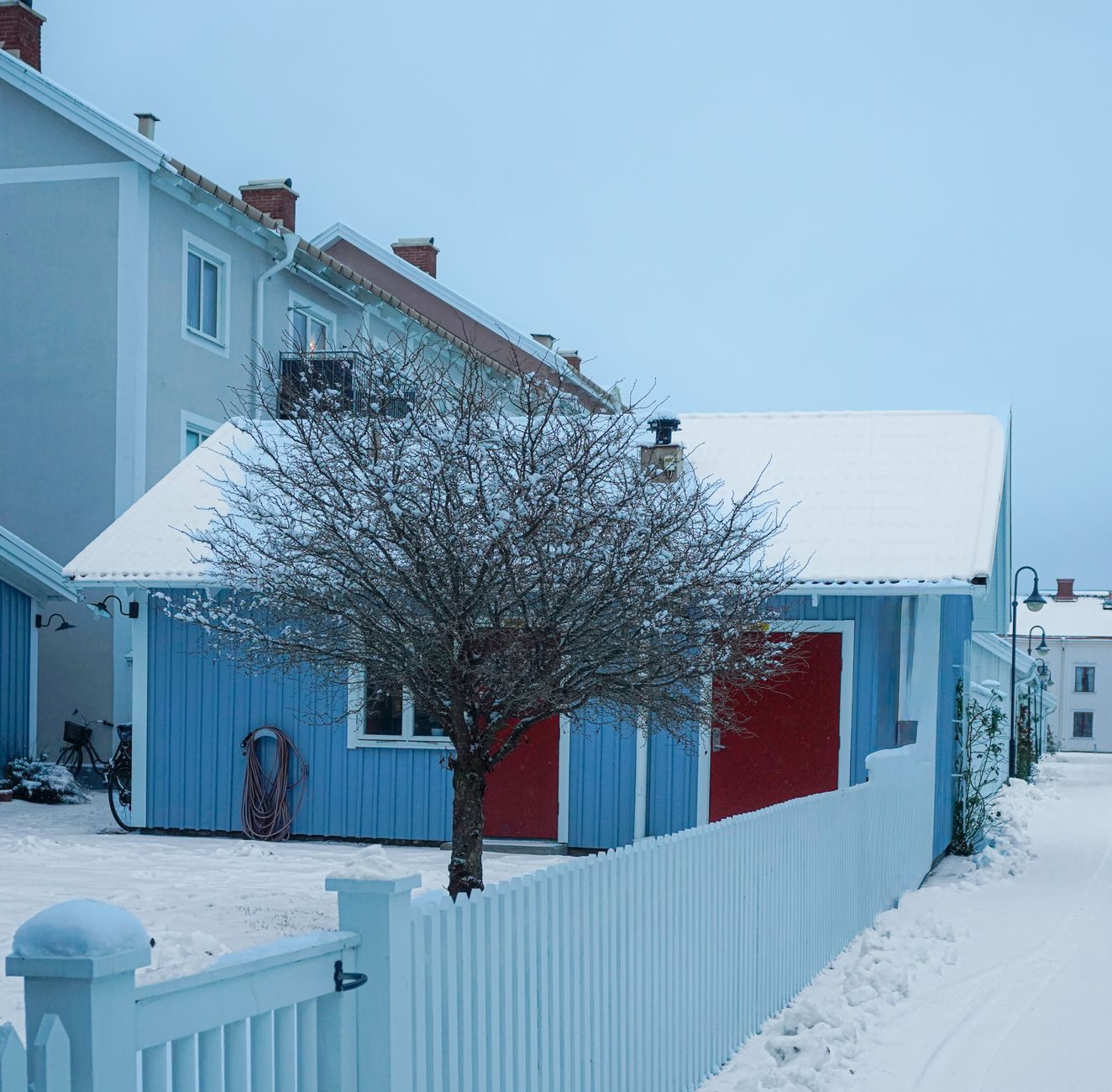 A snow-covered residential street